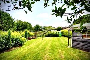 a yard with a green lawn with a house at Prestigious Georgian Mansion 