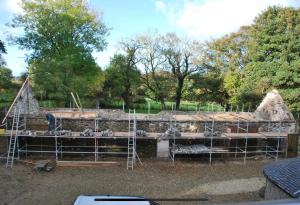 a group of sheep in a barn under construction at The Old Bushmills Barn in Bushmills