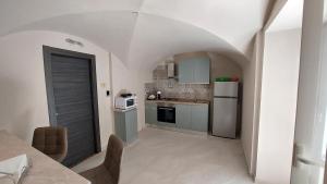 Η κουζίνα ή μικρή κουζίνα στο I 3 Principi, Garibaldi Suites