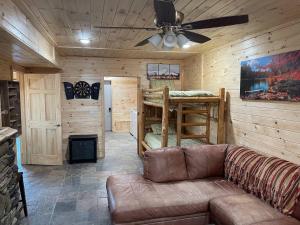 a living room with a couch and a bunk bed at OVERLOOK LODGE in Banner Elk