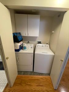 a small laundry room with a washer and dryer at 1 Bedroom & Office Near Caltrain and Stanford in Palo Alto