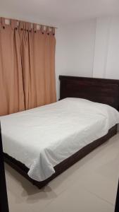 Ένα ή περισσότερα κρεβάτια σε δωμάτιο στο CHALET SAN MARCOS NEIVA HUILA