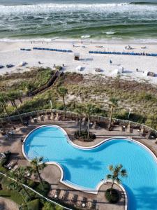 an aerial view of a pool and the beach at Grand Panama Beach Resort 1-1103 in Panama City Beach