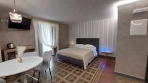Postel nebo postele na pokoji v ubytování I 3 Principi, Garibaldi Suites