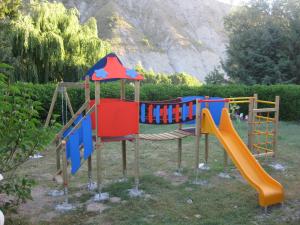 a playground with a slide and a slideintend at Il Molino Della Contessa in Castelmezzano