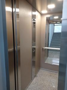 a sliding glass door in a room with stairs at Happy Place apartment 1 bedroom in Bar