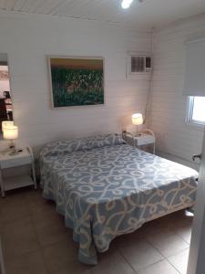 Un pat sau paturi într-o cameră la CABAÑAS LOS OLIVOS