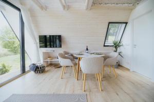 a dining room with a table and chairs at Grafit Kabin in Nagykanizsa