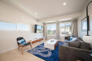 a living room with a couch and a table at Morro Bay Vacation Rentals in Morro Bay