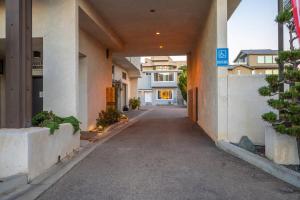 an empty alley with a building in the background at Morro Bay Vacation Rentals in Morro Bay