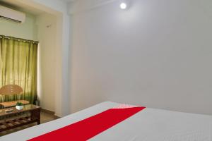 Postel nebo postele na pokoji v ubytování Hotel O K S Inn Hotel