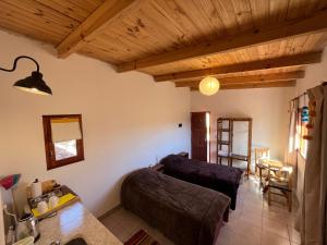 a living room with a couch and a table at LA MULITA HUMAHUACA in Humahuaca