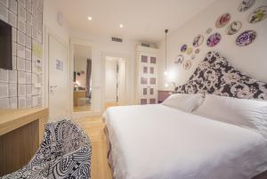 Postel nebo postele na pokoji v ubytování Cinque Rooms