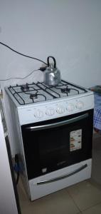 a tea kettle sitting on top of a stove at 3 cuadra polideportivo in San Vicente