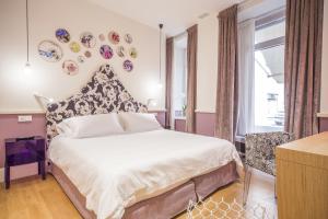 Postel nebo postele na pokoji v ubytování Cinque Rooms