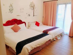 Vuode tai vuoteita majoituspaikassa Yilan Greenbird of Happiness B&B