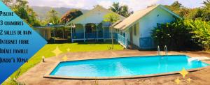a house and a swimming pool in front of a house at TEVIHOUSE 2 Bedrooms House or-and Bungalow with Pool in Taravao