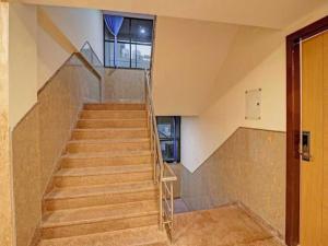 a staircase in a building with a stair case at Collection O 93572 HOTEL EXECUTIVE INN in Silchar