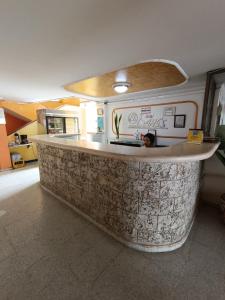 a kitchen with a stone counter in a room at Hotel Danes Barranquilla in Barranquilla