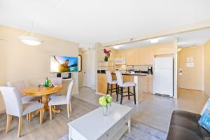 a living room and kitchen with a table and chairs at Diamond Head View at Waikiki Sunset with Parking in Honolulu +38 photos