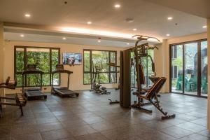 a gym with several treadmills and elliptical machines at Marianne Suites El Nido in El Nido
