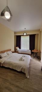 Postel nebo postele na pokoji v ubytování Hotel Canionel