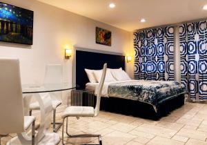 a bedroom with a bed and a glass table at Retreat at Crystal Manatee in Crystal River
