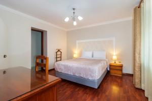 Postel nebo postele na pokoji v ubytování Hotel La Cartuja