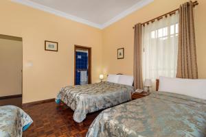 Postel nebo postele na pokoji v ubytování Hotel La Cartuja