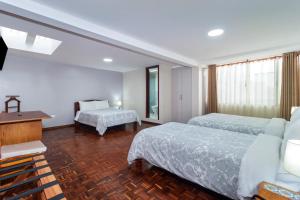 Postel nebo postele na pokoji v ubytování Hotel La Cartuja