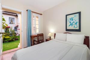 Postel nebo postele na pokoji v ubytování Hotel La Cartuja