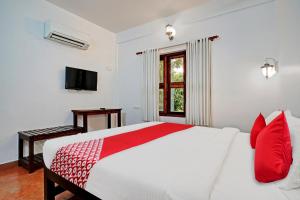 A bed or beds in a room at Flagship Cherai Panoramic Beach Hotel