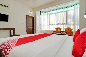 A bed or beds in a room at Flagship Cherai Panoramic Beach Hotel