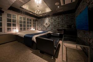 A bed or beds in a room at ホテル ジェムジェム 十三