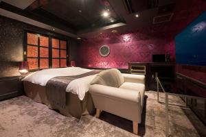 A bed or beds in a room at ホテル ジェムジェム 十三