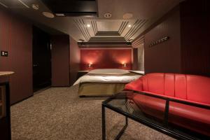 A bed or beds in a room at ホテル ジェムジェム 十三