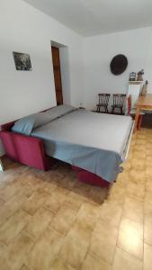 a bedroom with a large bed in a room at La veranda sul golfo in Monte SantʼAngelo