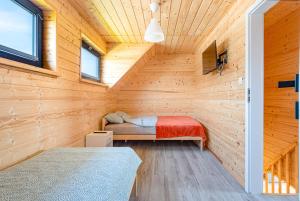 Postel nebo postele na pokoji v ubytování OSADA JANTAR 2 + 37 fotografií