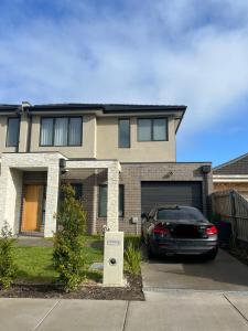 a black car parked in front of a house at Private Rooms in Clayton South Near Monash Uni in Clayton North