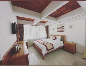 Giường trong phòng chung tại Gold Dream Hotel
