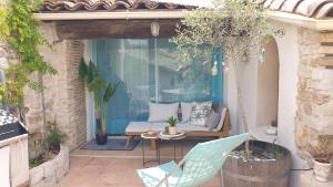 Posedenie v ubytovaní Maison avec Jacuzzi et terrasse sur les toits