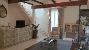 Posedenie v ubytovaní Maison avec Jacuzzi et terrasse sur les toits
