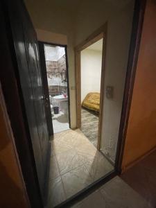 a mirror reflection of a room with a bedroom at Villa for rent,pool,big terraces,mountain view in Jerash