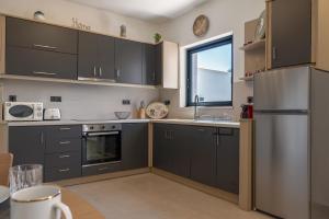 Kuchyň nebo kuchyňský kout v ubytování Cactus Villas