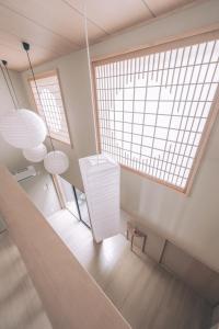 an overhead view of a living room with a large window at 櫛笥ノ家 Machiya Kushige in Kyoto