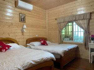 Giường trong phòng chung tại Xiao Tang Villa