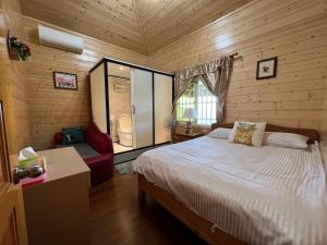 Giường trong phòng chung tại Xiao Tang Villa