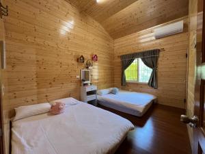Giường trong phòng chung tại Xiao Tang Villa