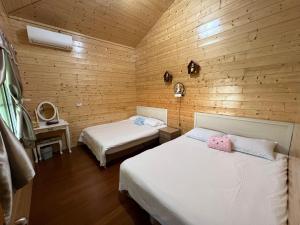 Giường trong phòng chung tại Xiao Tang Villa