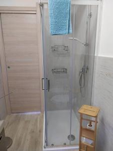 a shower with a glass door in a bathroom at LA Pavoncella in La Maddalena